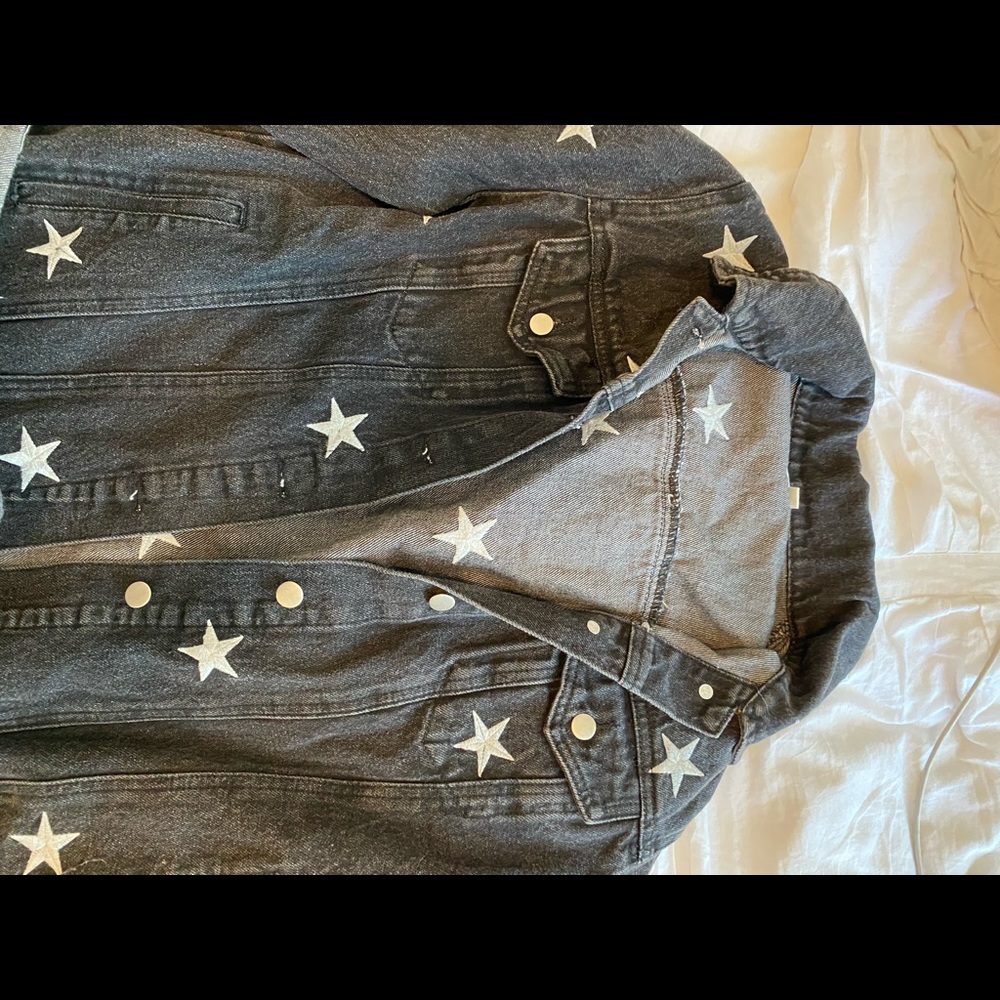 Black denim jacket with stars